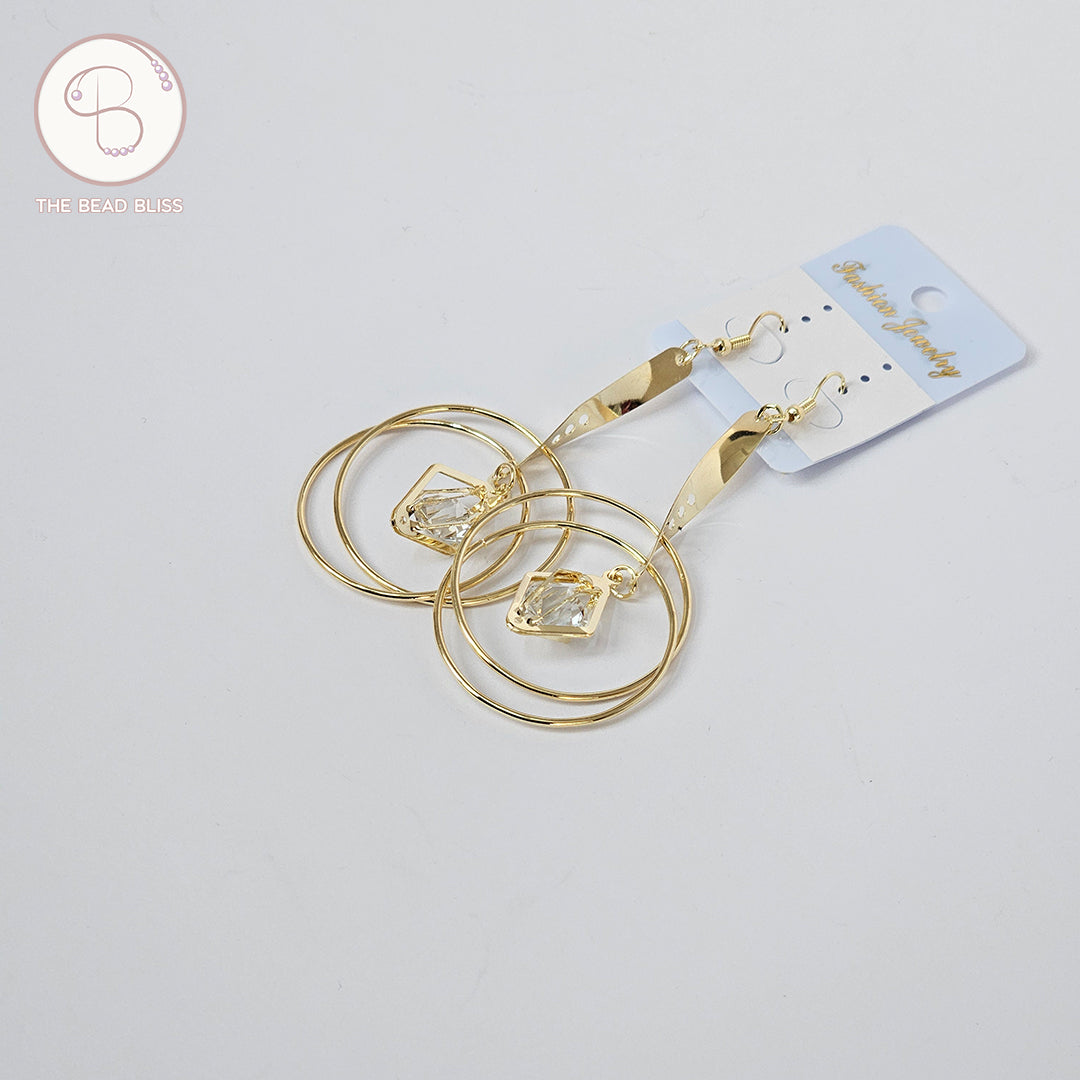 Golden Spiral Hoop Earrings with Crystal Drop